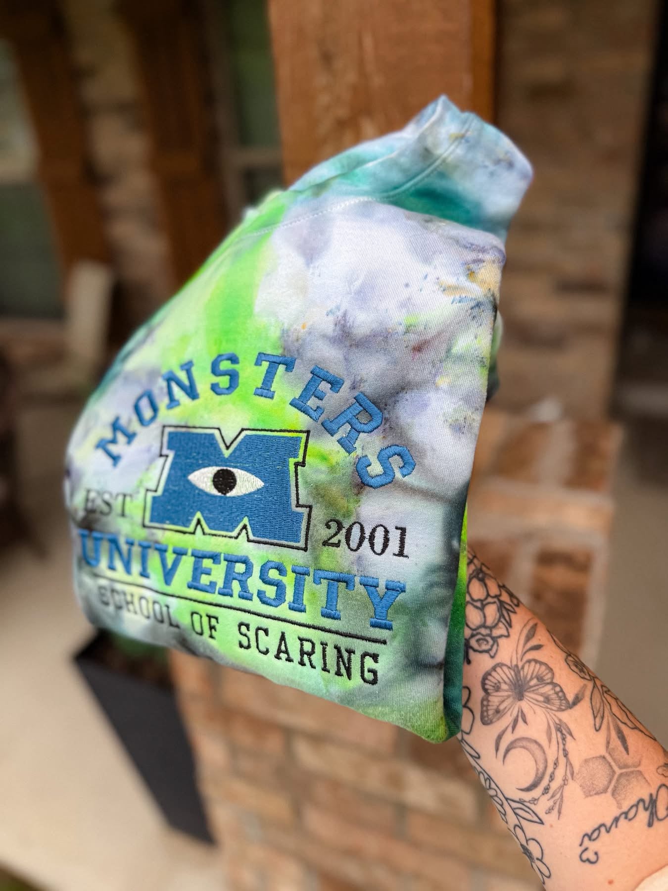 Monsters Inc. We scare because We Care Tie-Dye Crewneck Sweatshirt