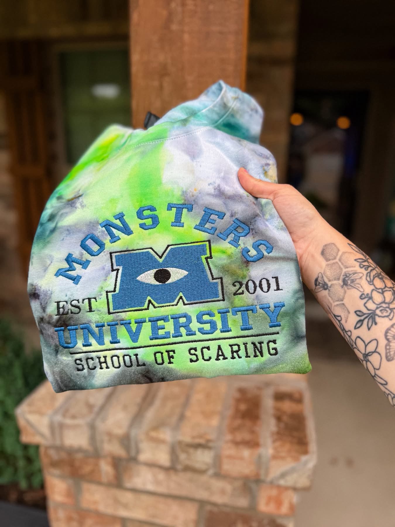 Monsters Inc. We scare because We Care Tie-Dye Crewneck Sweatshirt