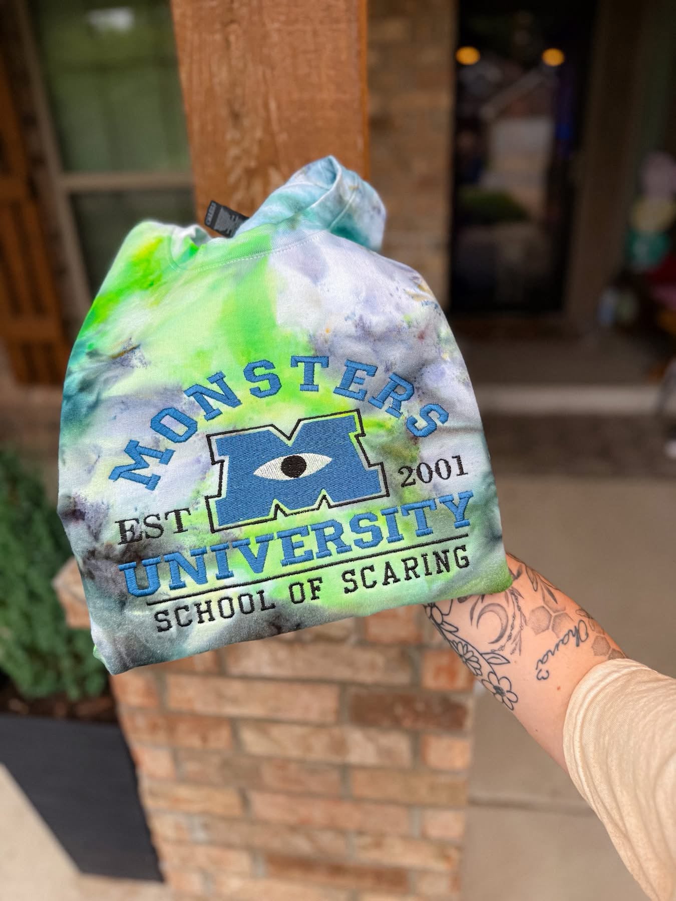 Monsters Inc. We scare because We Care Tie-Dye Crewneck Sweatshirt